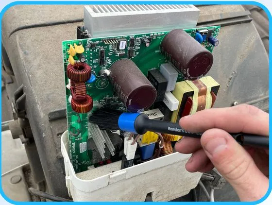 Electrical board being cleaned
